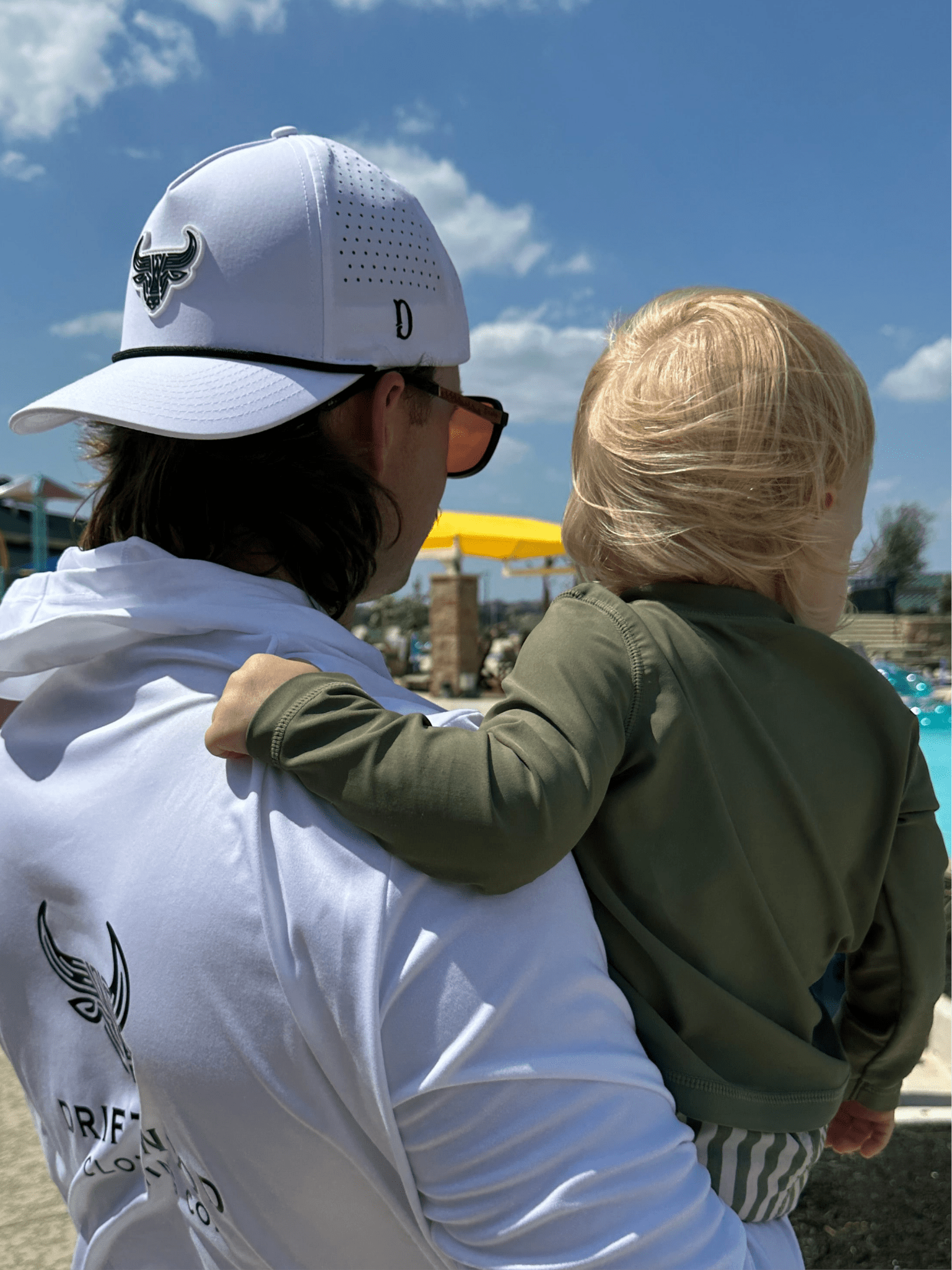 Father and son enjoying a day at the pool